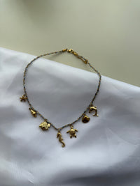 Steel necklace with pendant charms in multi-colored colors