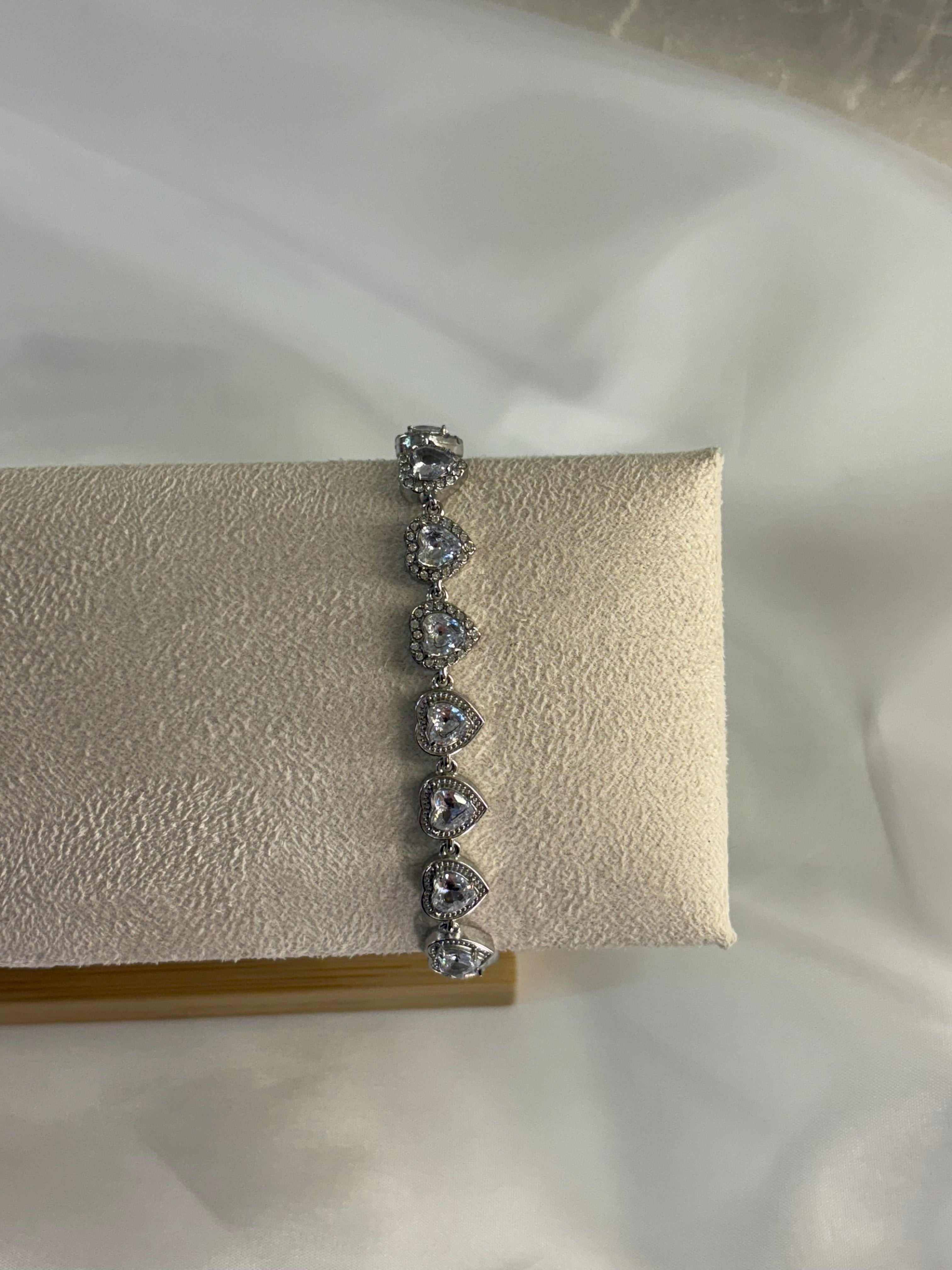Silver-colored bracelet hearts love