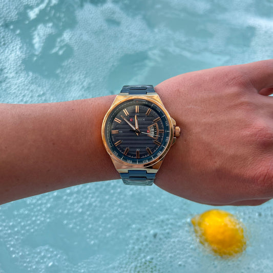 Ανδρικό Ρολόι Curren σε Μπλε και Rose Gold με Ημερομηνία και Σπορ Καντράν